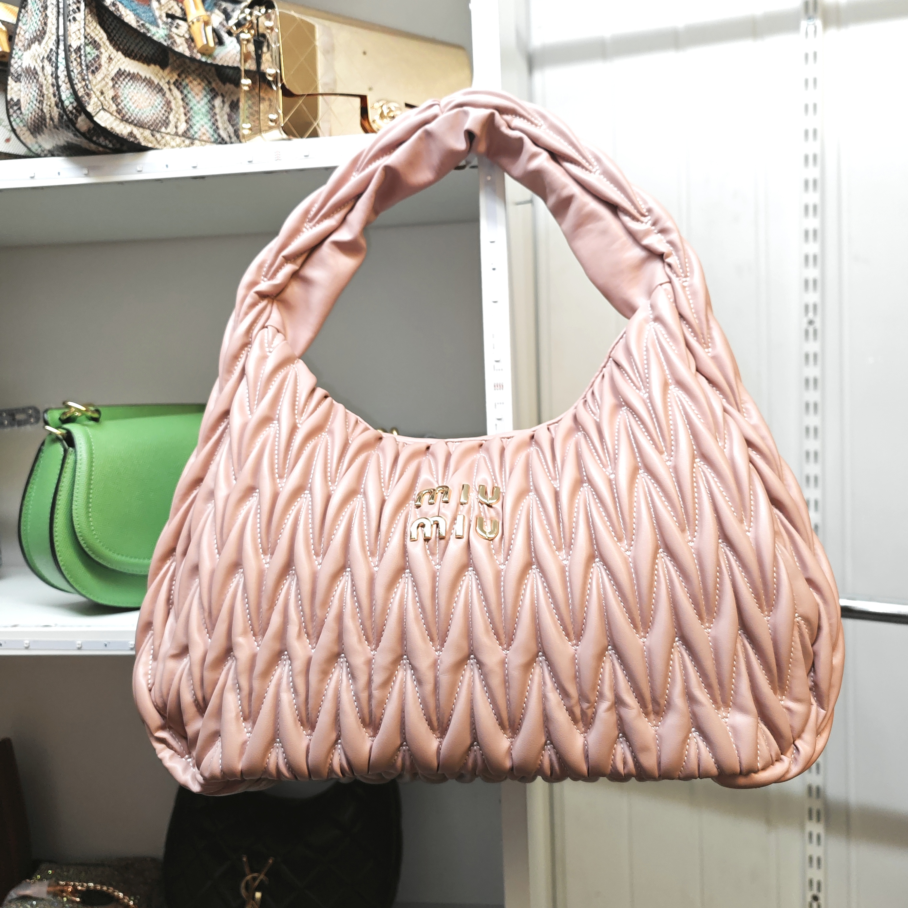 Pink quilted hobo bag
